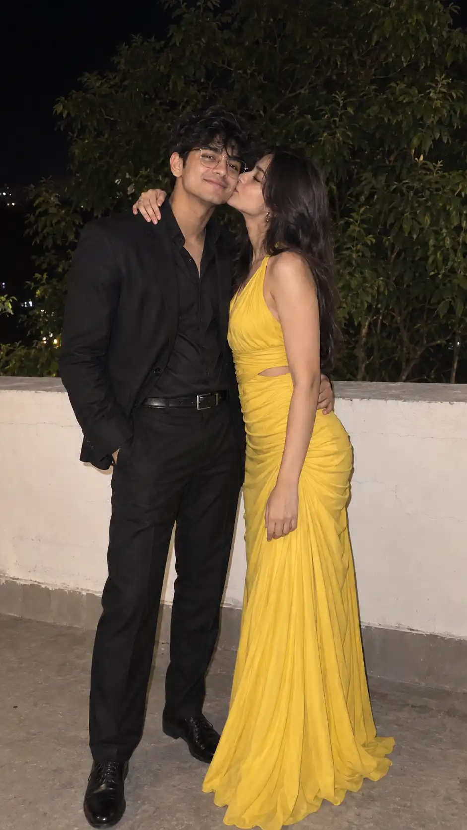 Example result for Black and Yellow Couple Outfit Night Photo AI image prompt